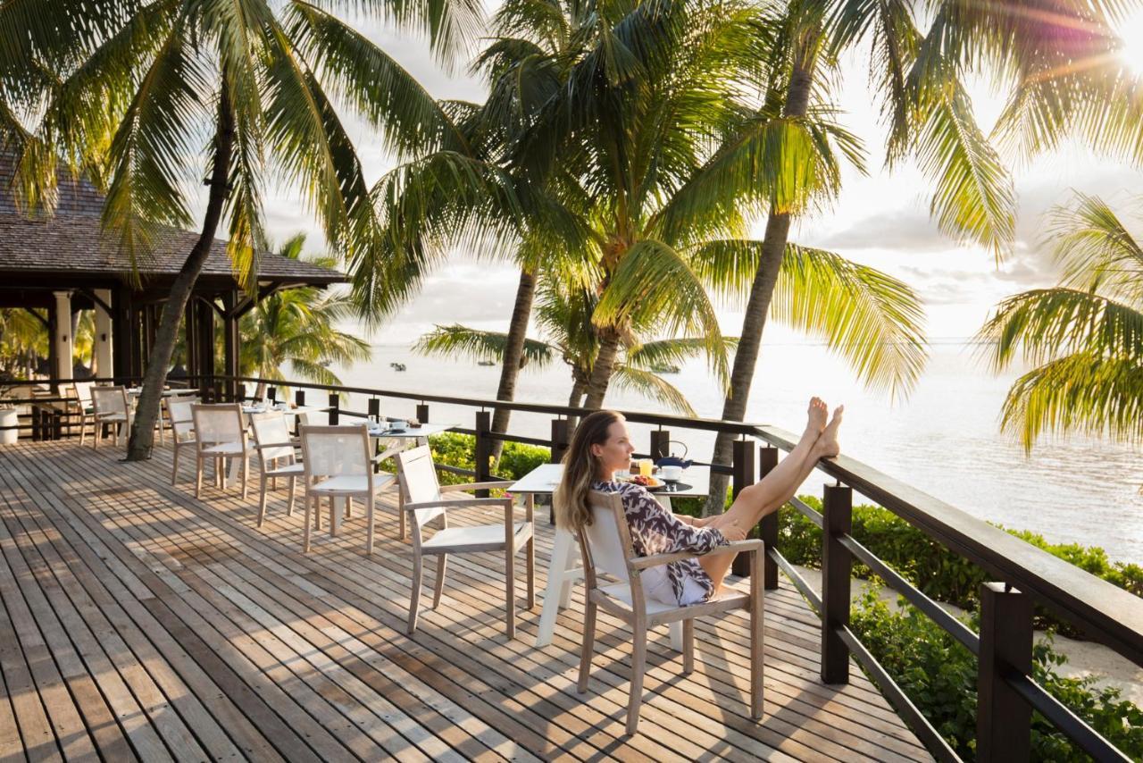 Lux* Le Morne Resort Екстер'єр фото A woman relaxing on a deck